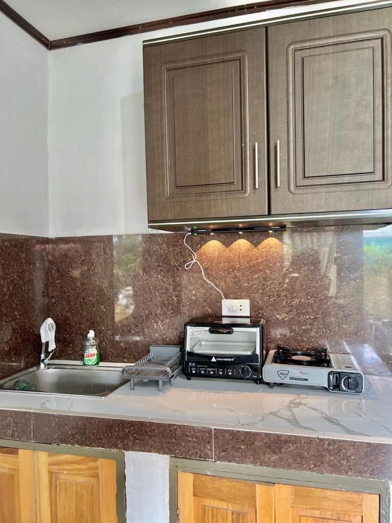 Panagsama Holiday Cottage Moalboal Bagian luar foto